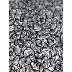 an intricate black and white drawing with flowers in the center, on a piece of paper