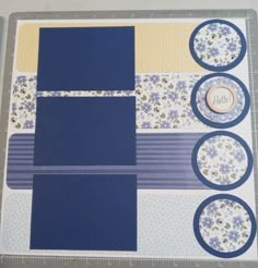 a blue and yellow scrapbook with buttons on it