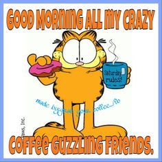 the garfield cat is holding a donut and drinking coffee