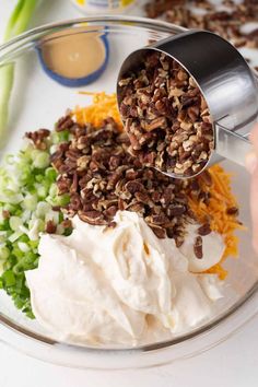 the ingredients are being mixed together in a glass bowl to make an appetizer