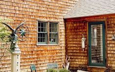 a small wooden house with a green door