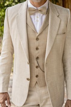 a man wearing a suit and bow tie