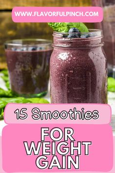 two mason jars filled with blueberries and spinach on top of a wooden table