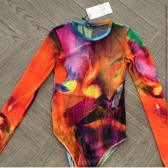 Nwt Zara Multicolored Bodysuit Trendy Stretch Multicolor Bodysuit, Spring Multicolor Stretch Bodysuit, Fitted Multicolor Printed Bodysuit, Trendy Multicolor Printed Bodysuit, Multicolor Long Sleeve Stretch Bodysuit, Spring Multicolor Fitted Bodysuit, Fitted Multicolor Bodysuit For Spring, Vibrant Jumpsuits And Rompers For Spring, Zara Stretch Bodysuit For Spring