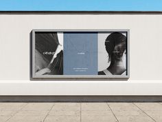 an advertisement on the side of a building with two women's haircuts