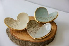 This beautiful ring dish is too sweet not to share! Lovingly handcrafted and edged in gold leaf, we just know that this special piece will be treasured for years to come. Lace imprint pattern Gold leaf edge detail Measures approximately 4.5" x 3.5" All of our pottery is handmade in Chelsea, Alabama by women fleeing homelessness and domestic abuse. 100% of the proceeds from Prodigal Pottery sales support the women we employ, paying salaries and providing life changing benefits so our women have h Heart Pottery, Pottery Sale, Beginner Pottery, Diy Air Dry Clay, Diy Ceramic, Clay Crafts Air Dry, Slab Pottery, Hand Built Pottery, Pottery Crafts