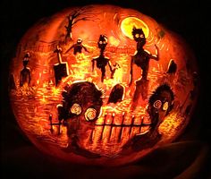 a carved pumpkin with people on it