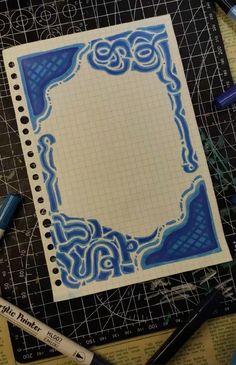 a piece of paper with blue designs on it