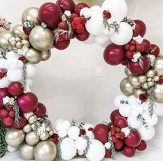 a wreath made out of balloons and christmas decorations