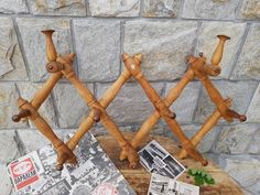 two wooden pegs that are sitting on a table next to some pictures and brochures