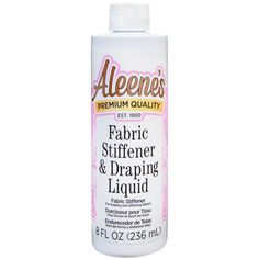 a bottle of fabric and drapering liquid on a white background with the words,'fabric stiffener & draping liquid '