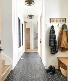 the hallway is clean and ready to be used as a mud room or office space