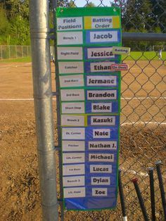 a baseball field with many signs on it