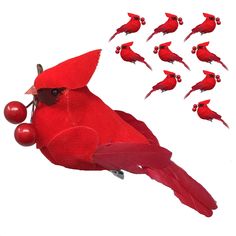 a red bird with many small birds in it's beaks and on its back legs