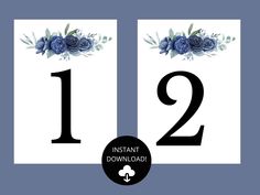 the number twelve is decorated with blue flowers and greenery in black lettering on a white background