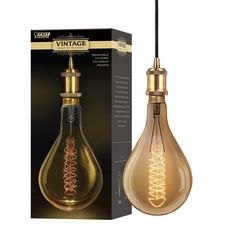 the light bulb is gold and has an intricate design on it's side, with a black box behind it