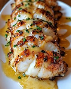 grilled scallops with sauce on a white plate