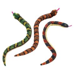 two colorful snakes are on the white surface