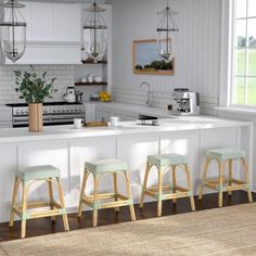 three stools are in front of the kitchen counter