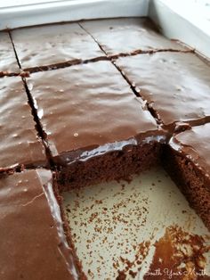 a chocolate cake is cut into pieces and ready to be eaten