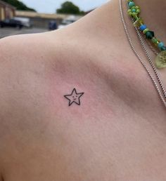 a person with a star tattoo on their chest