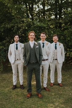 Groom with Groomsmen in Cream Wedding Suits Sage Green Bride And Groom, Green And Cream Wedding Suits, Colored Grooms Suits, Green Suit Summer Wedding, Green Groom Suit With Groomsmen, Cream And Green Groomsmen Attire, Sage Green Wedding Suit Groomsmen, Pastel Wedding Groom Suit, Dark Sage Suit