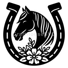 a black and white horse head in a horseshoe with flowers on the side, isolated against a