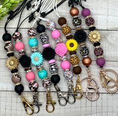 several different types of key chains with flowers on them