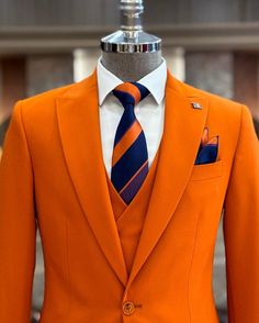 The Brabion Abbot Orange Slim Fit Suit is designed for the modern man who values sophistication and comfort. This elegant three-piece suit includes a jacket, vest, and pants, making it perfect for business meetings, weddings, and other special events. Crafted from a blend of 55% cotton and 45% polyester, it boasts a refined slim-fit cut and double slits for an added touch of style. Ideal for the discerning gentleman, this suit ensures you make a lasting impression at any occasion. - Material: 55 Orange Suit, Vest And Pants, Suit Material, Jacket Vest, Slim Fit Suit, Three Piece Suit, Dry Clean Only, Three Piece, Modern Man