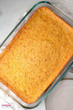 a glass casserole dish filled with food on top of a white countertop