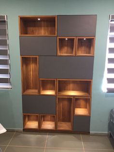 an empty room with several shelves on the wall