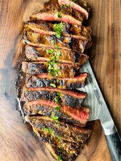 steak on a cutting board with a knife