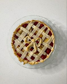 a pie sitting on top of a glass plate