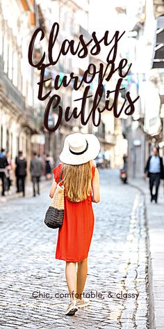 a woman in an orange dress and white hat walking down the street with her back to the camera