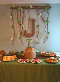 a table topped with lots of food and desserts