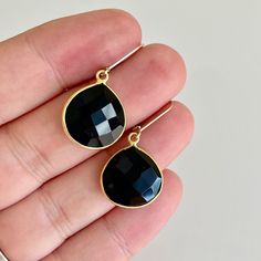 Onyx Earrings, Black Onyx Teardrop Earrings in Gold, Jet Black Bezeled Faceted Drop Earrings, Boho Chic Black Jewelry, Gift for her These eye catching earrings feature shinny faceted Black Onyx teardrops bezeled framed in 14k gold filled. The stunning midnight black heatshape drop earrings are suspended from lever back ear wires in gold filled. These are very modern, flattering on the face and will match endless outfits. a must have pair in your jewelry box About These Earrings: - Gemstone:  Bla Black Faceted Jewelry As A Gift, Black Drop Teardrop Earrings For Party, Black Teardrop Drop Earrings For Party, Black Teardrop Earrings For Party, Black Faceted Jewelry For Gift, Handmade Black Teardrop Earrings For Party, Black Teardrop Jewelry With Matching Earrings, Black Nickel-free Earrings For Party, Nickel-free Black Earrings For Party