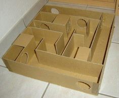 an open cardboard box sitting on the floor