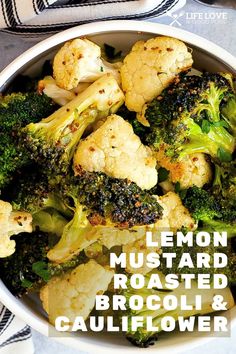 a bowl filled with broccoli and cauliflower on top of a table