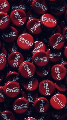 coca - cola bottle caps are seen in this image