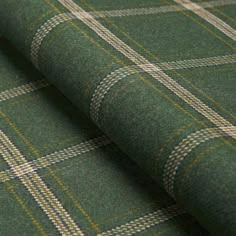 a green plaid fabric with yellow and white checkers on the outside, it is very soft