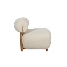 a white sheep shaped chair with wooden legs