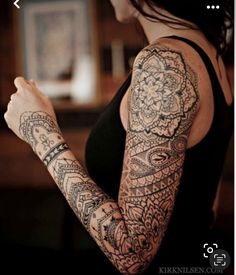 a woman with a tattoo on her arm