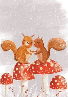 two squirrels sitting on top of mushrooms in the snow