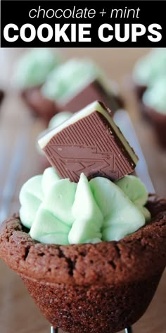 chocolate cupcakes with mint green frosting and a cookie bar in the middle