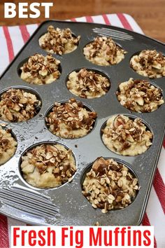 fresh fig muffins in a muffin tin on a red and white striped napkin