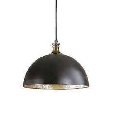 an industrial style pendant light hanging from a ceiling fixture with a black metal dome shade