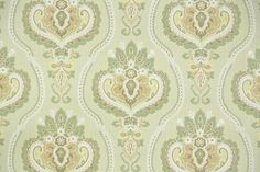 a green and beige wallpaper with an ornate design