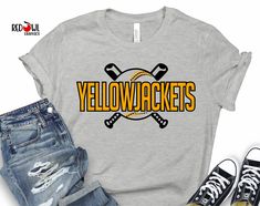 the yellowjackets t - shirt is next to jeans and sneakers