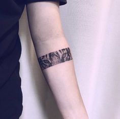 a woman with a tattoo on her arm