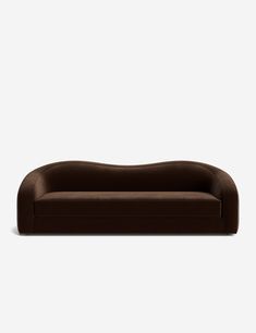 a brown couch sitting on top of a white floor